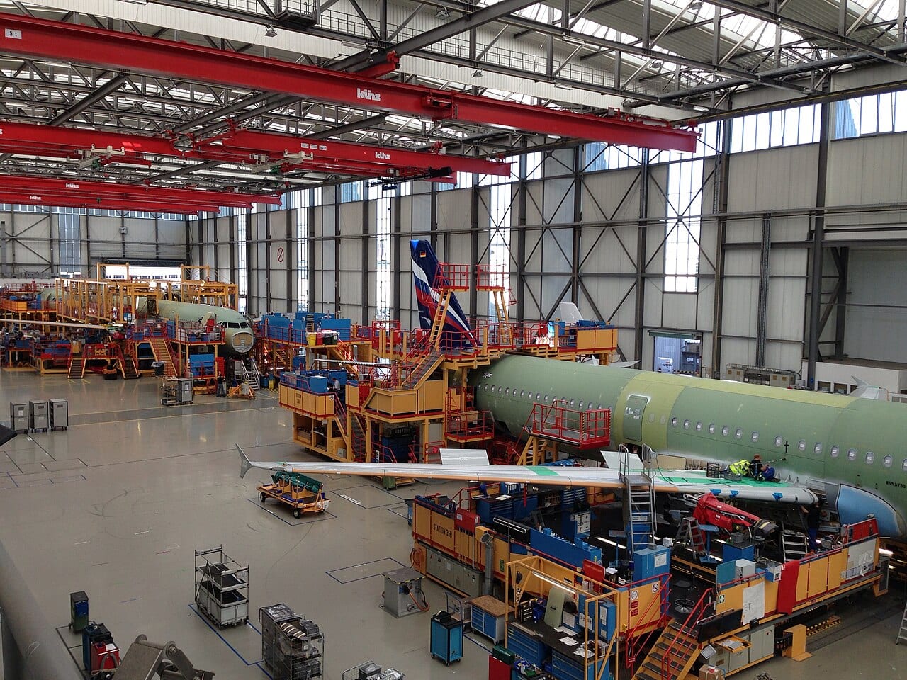 Workers and machinery along Airbus's A321 final assembly line at its Hamburg plant