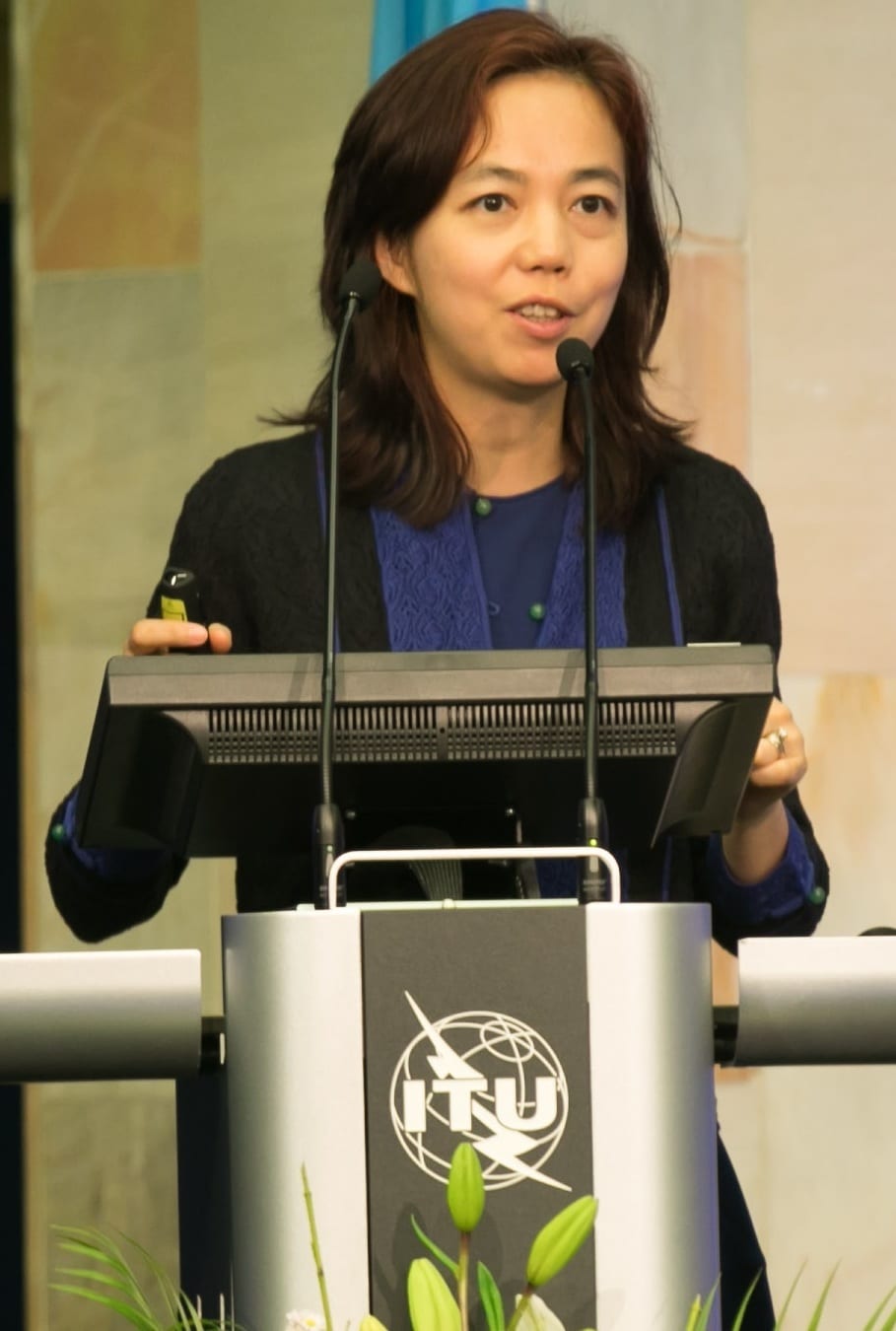 Fei-Fei Li speaking at a conference