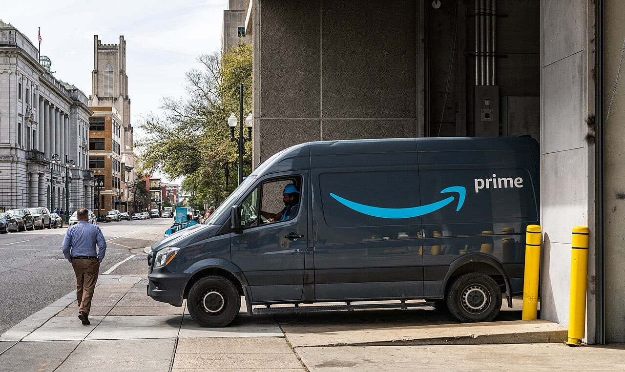 An Amazon Prime delivery van parked on a downtown street in New Orleans