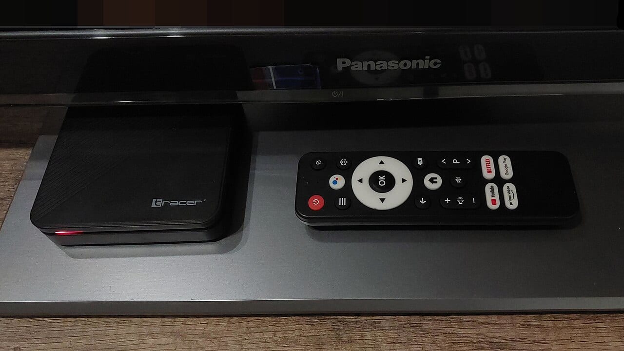 A small off-brand Android TV box sitting on a shelf