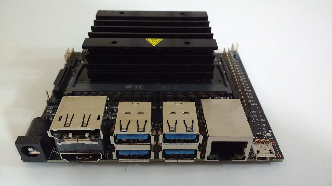 An NVIDIA Jetson Nano developer kit, a small green circuit board