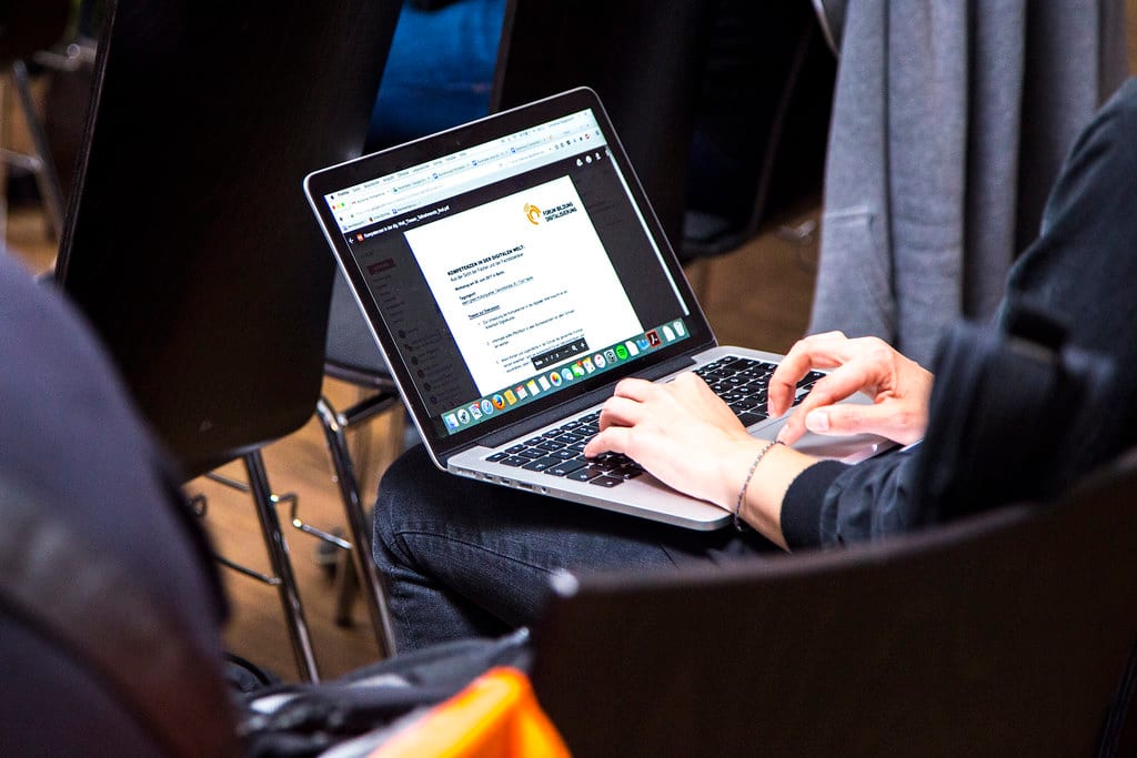 A person works through a long session at a laptop