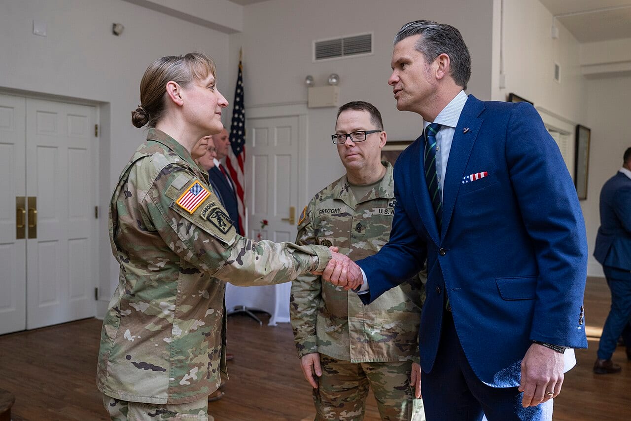Defense Secretary Pete Hegseth awarding coins to troops at the U.S. Army War College in April 2025