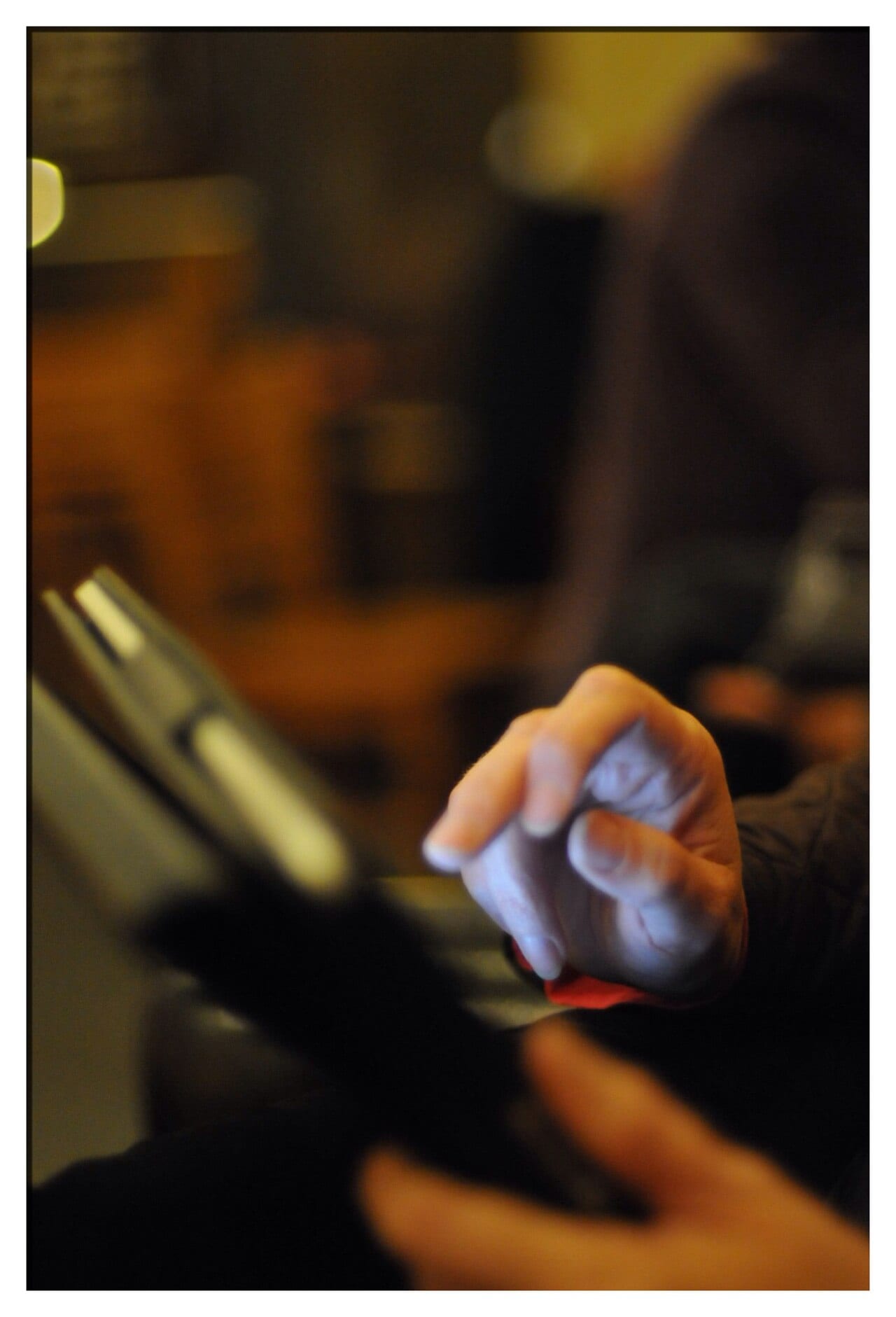 A woman holds and looks at an iPad
