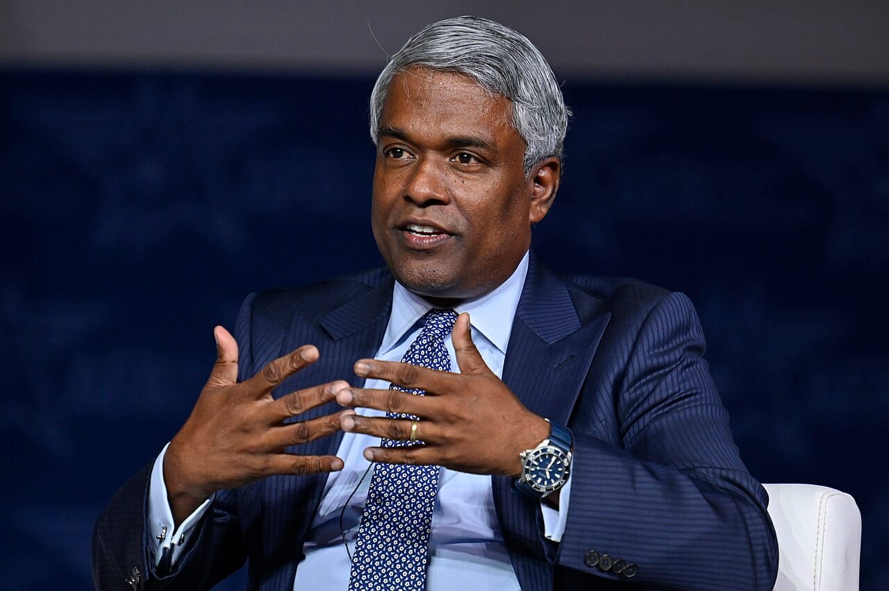 Thomas Kurian speaks on a panel at a conference