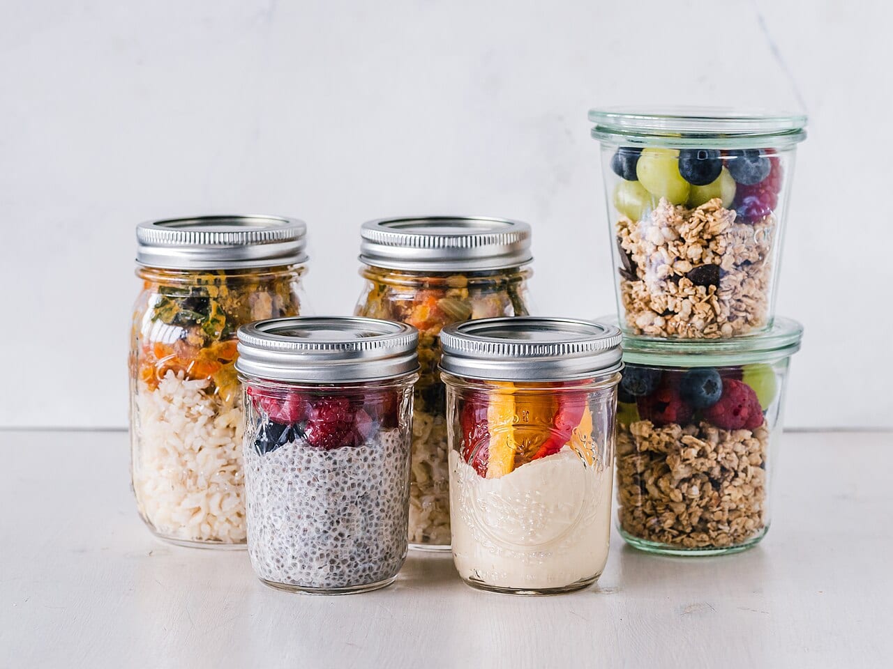 Breakfast and lunch portions divided into meal prep containers for the week