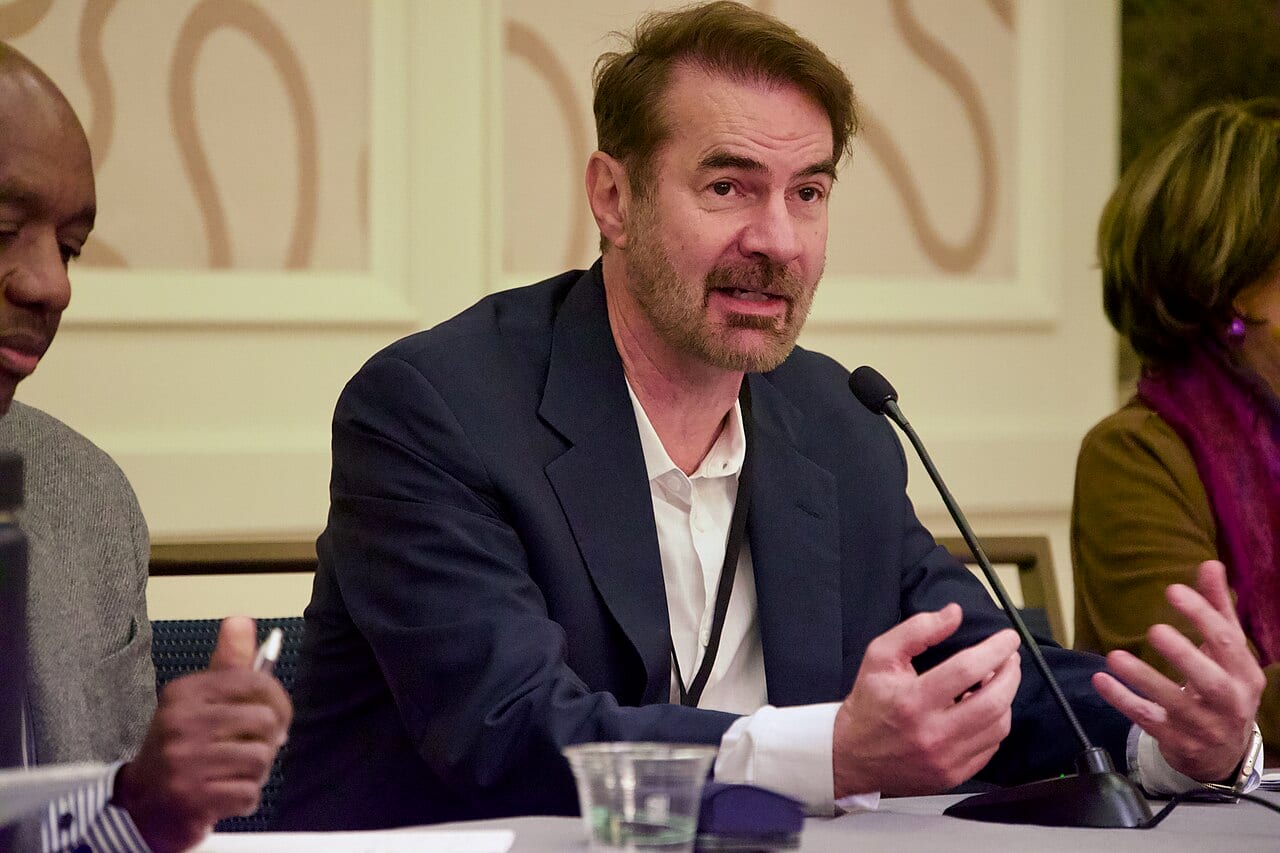 Erik Brynjolfsson speaks at an economics conference podium