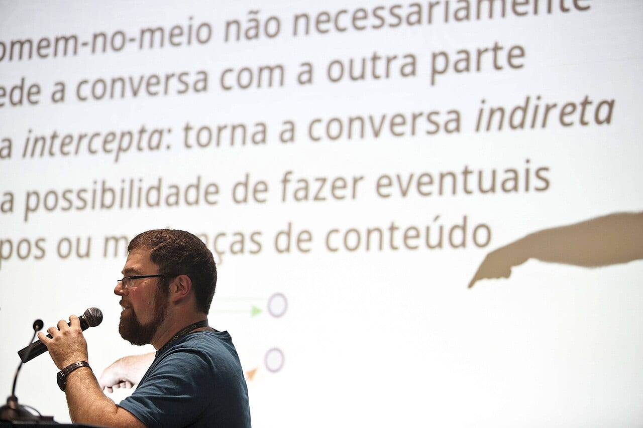 A speaker presents Let's Encrypt on stage at the FISL 16 conference in Porto Alegre in July 2015