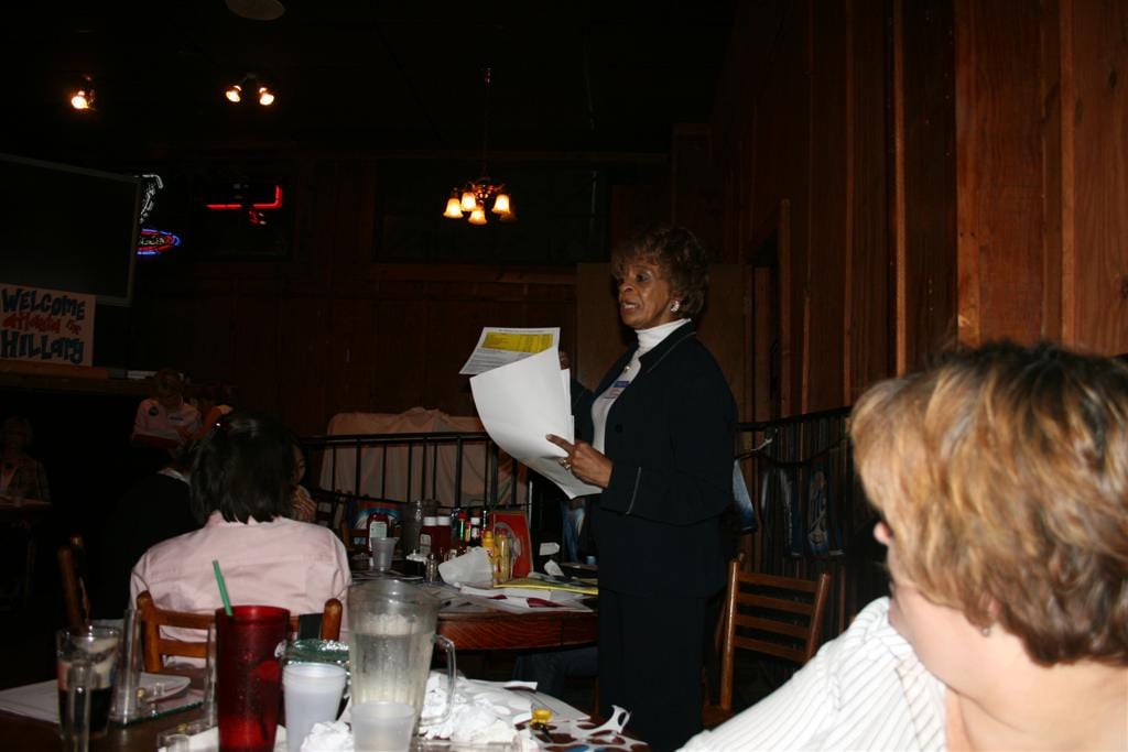Deputy voter registrars from Fulton County, Georgia, explain registration and absentee ballot rules to residents