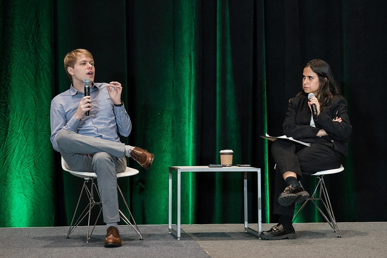 Dan Hendrycks speaks on stage at a technology conference