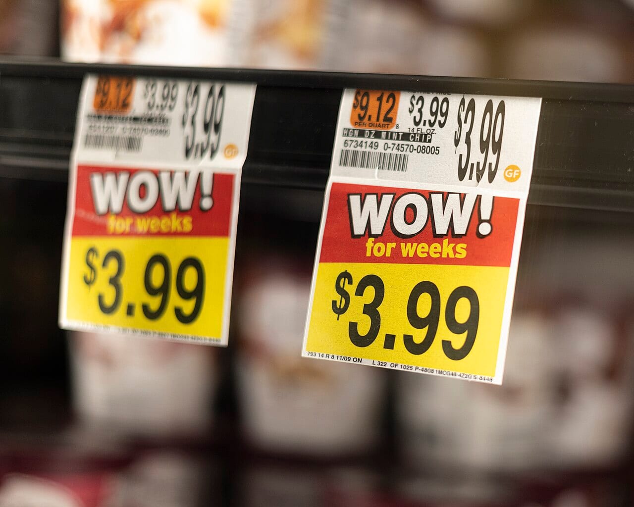 A grocery store price tag reading WOW above a discounted price