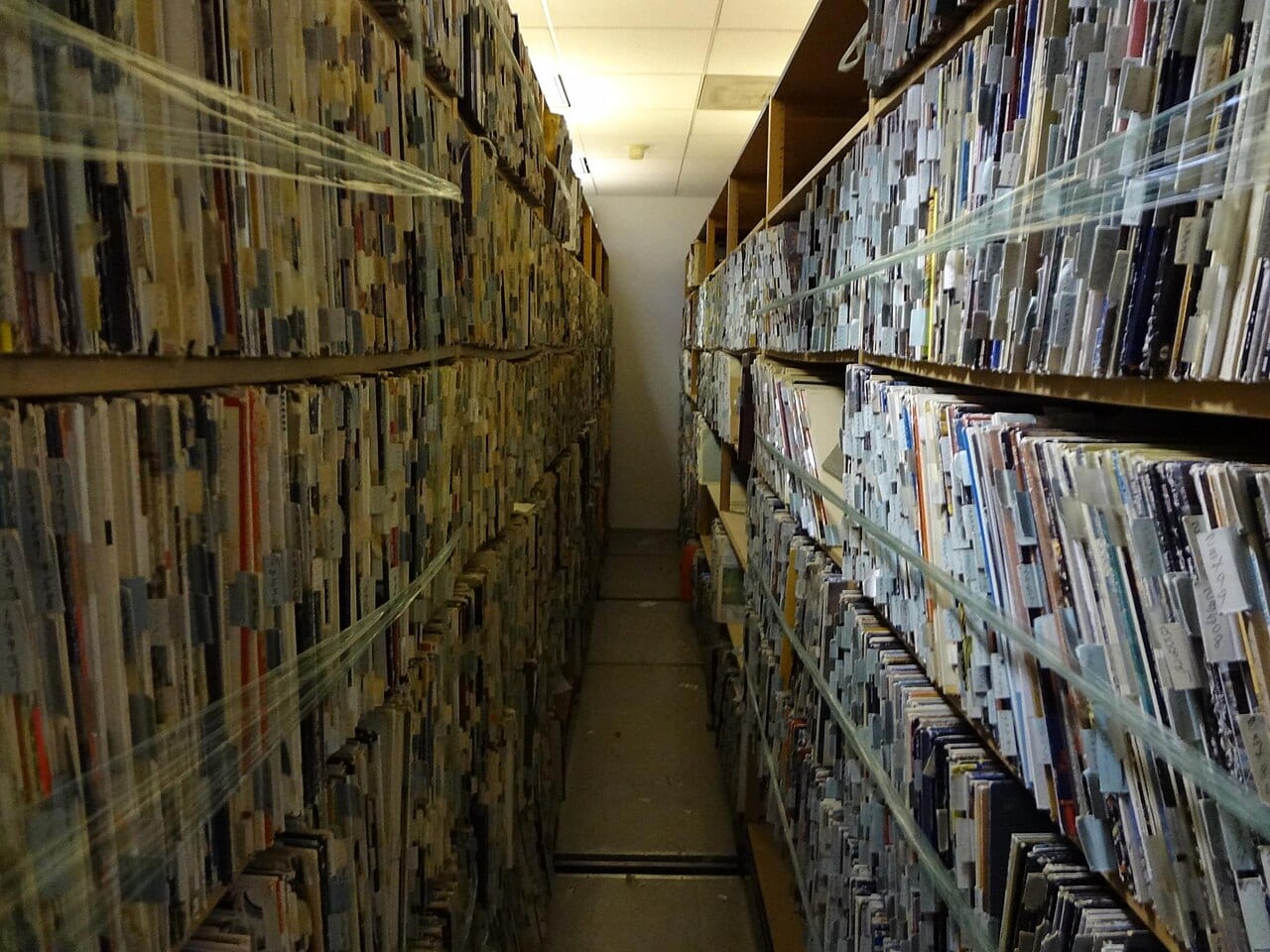 Shelves of vinyl records awaiting inspection, the kind of catalog labels say AI music tools trained on outside any license