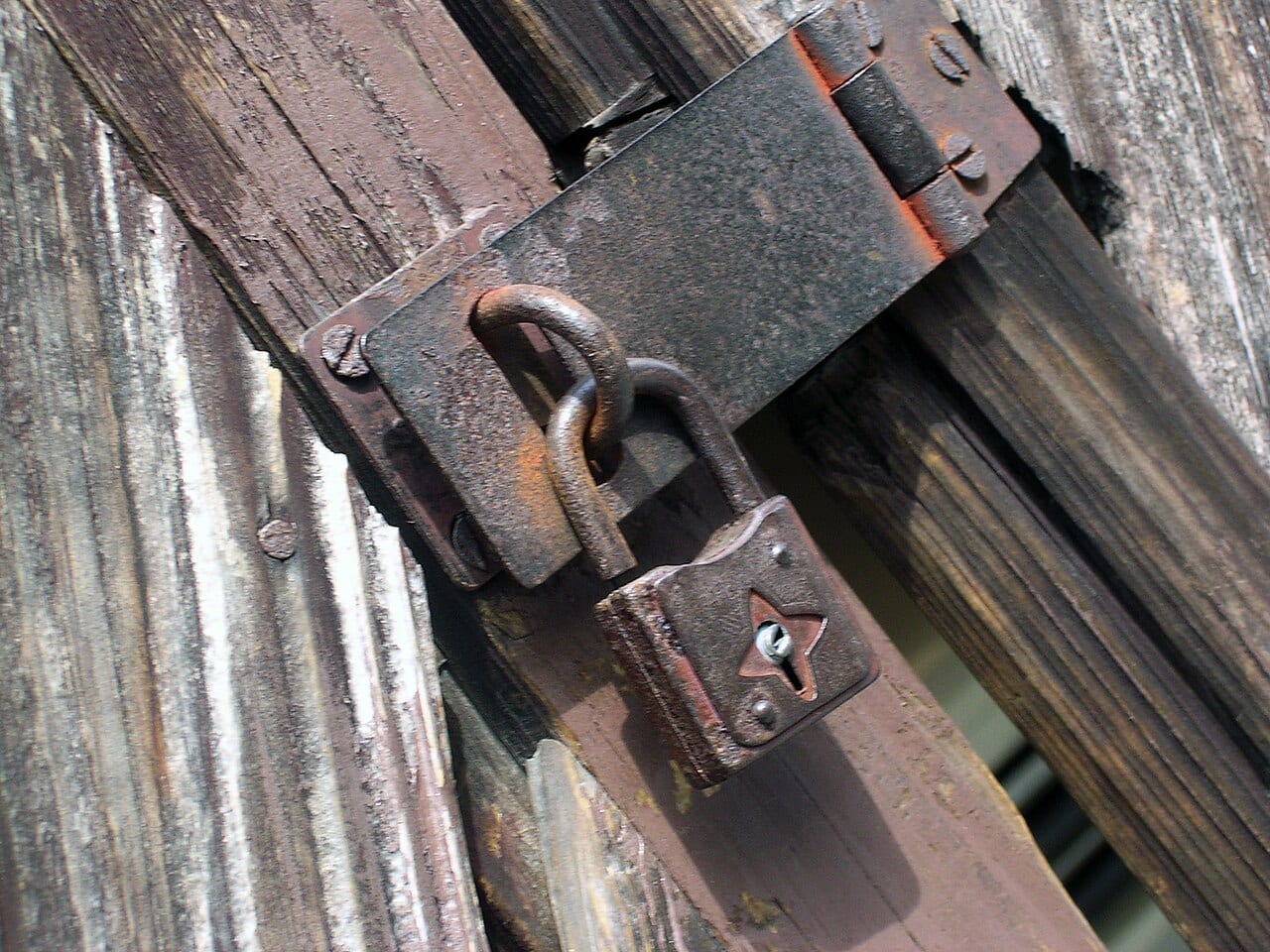A modern brass padlock and its key