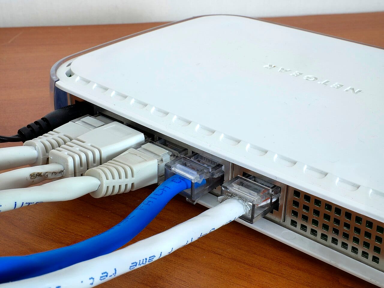 Network cables plugged into the ports of a router