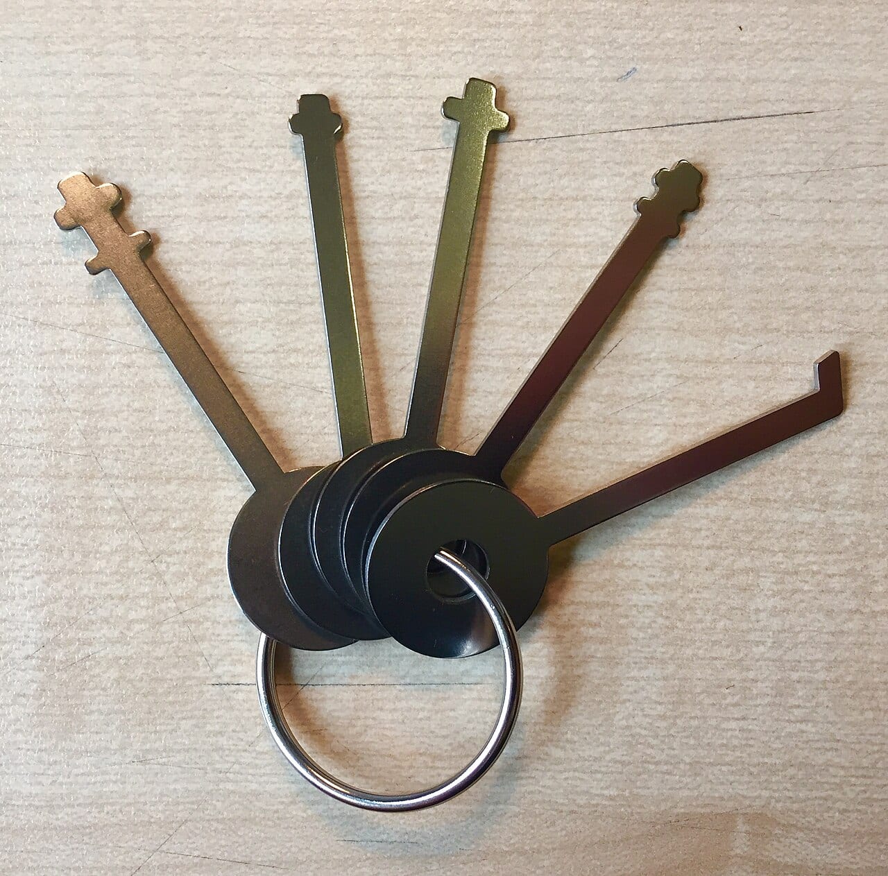 A set of skeleton keys that open many different warded padlocks