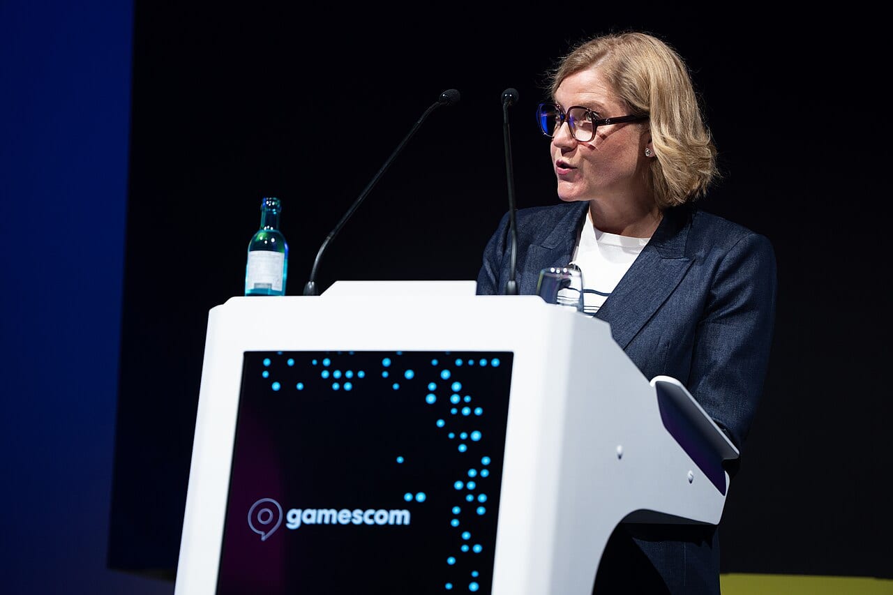 Henna Virkkunen speaks at a podium during a public event in Germany