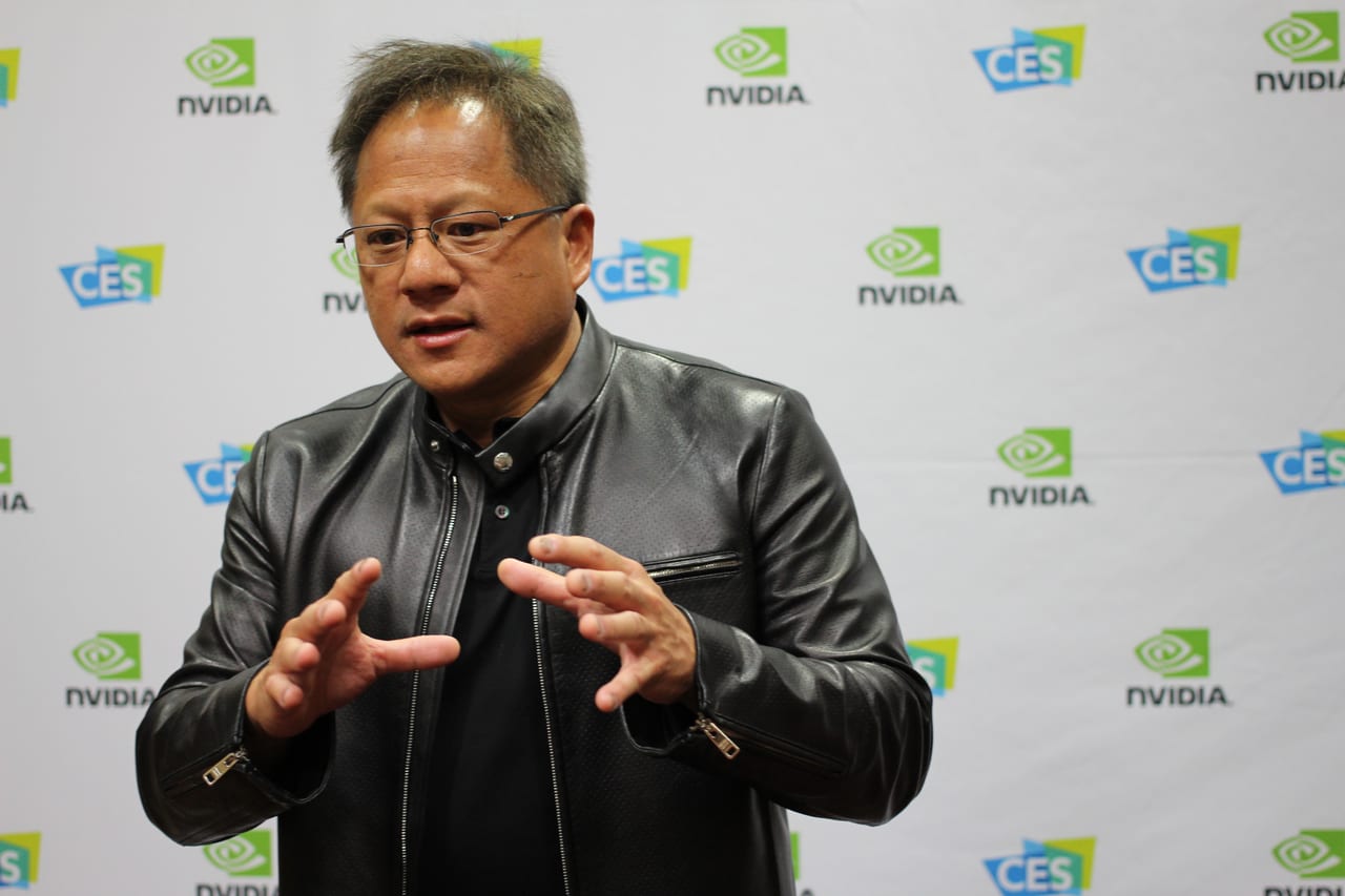 Nvidia CEO Jensen Huang gestures while speaking at a public event