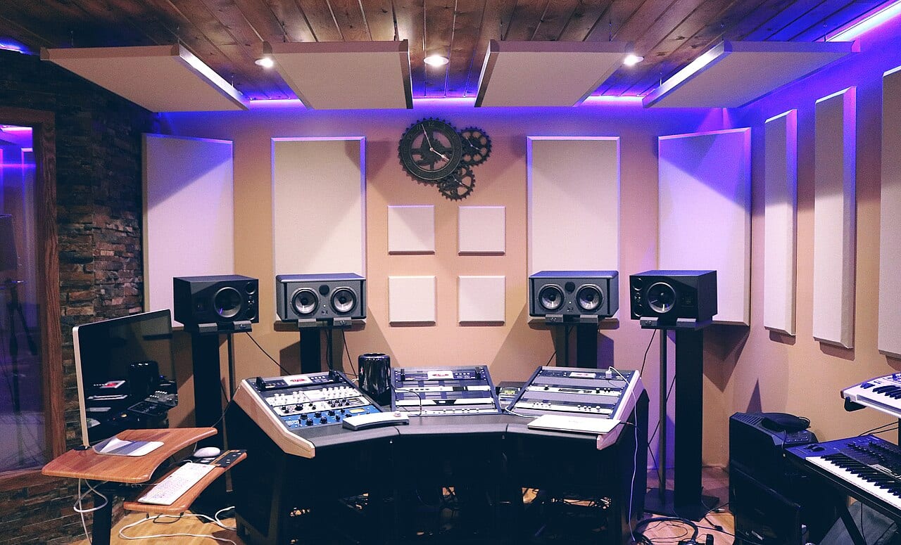 A digital audio workstation mixes sound in a recording studio