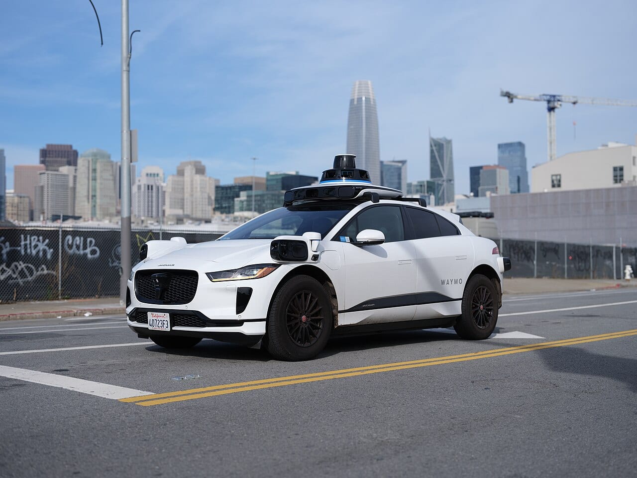 A Waymo robotaxi drives itself through the streets of San Francisco