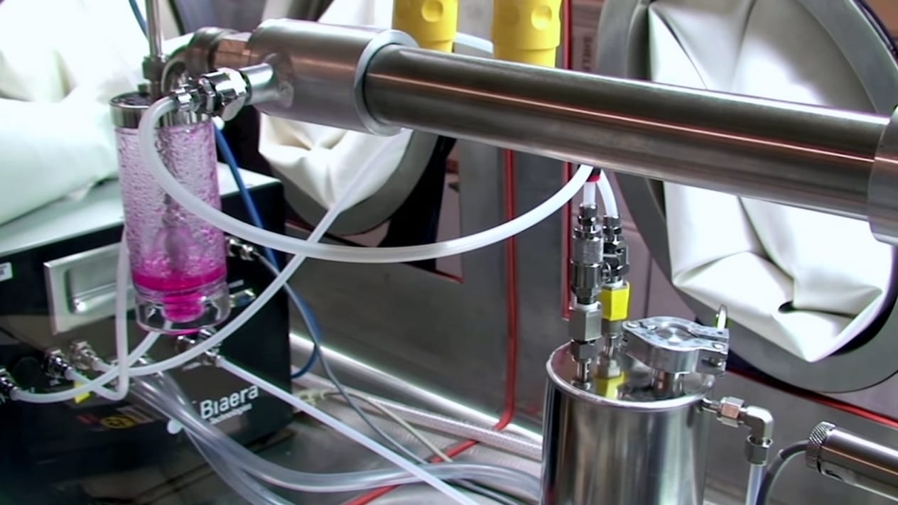 A Class III biosafety cabinet that isolates researchers from dangerous pathogens inside a maximum containment lab