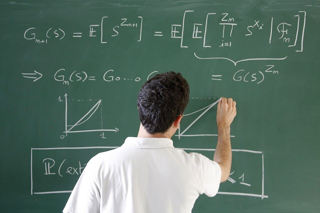 A chalkboard covered in a branching proof at a Paris applied mathematics center