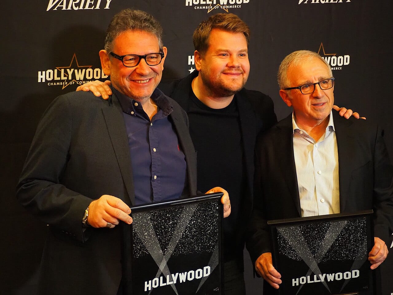 Lucian Grainge, James Corden and Irving Azoff stand together at a Hollywood event