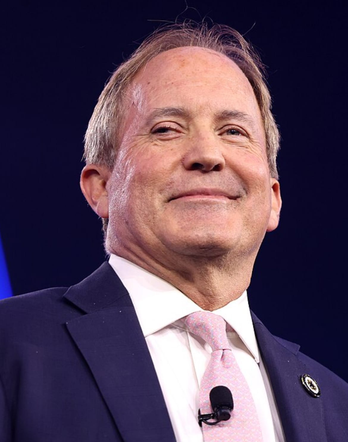 Texas Attorney General Ken Paxton speaking to a crowd in 2024