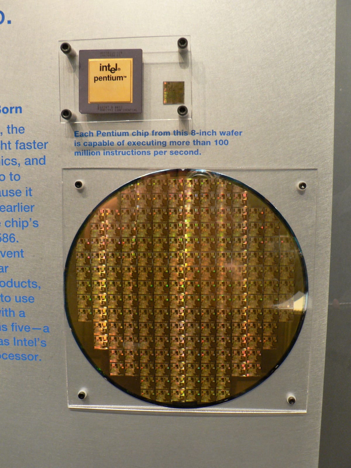 A silicon wafer holding dozens of uncut processor chips before they are sliced apart